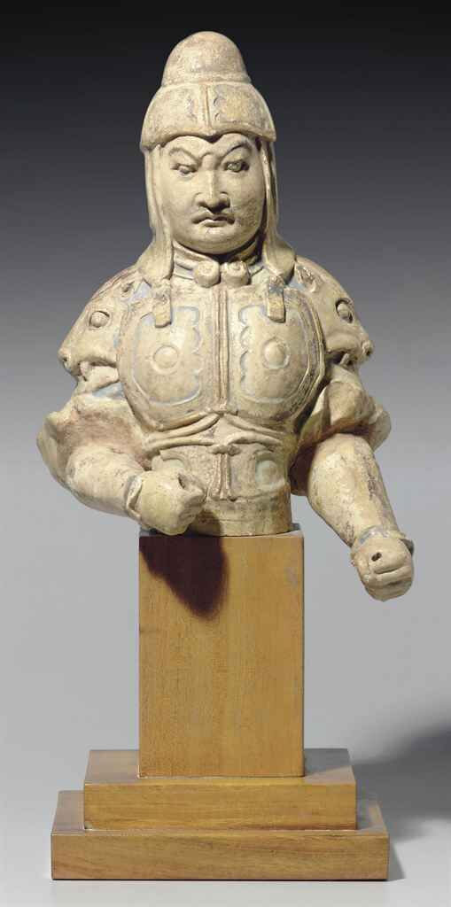 A painted straw-glazed torso of a guardian, Sui-Early Tang dynasty, 7th century