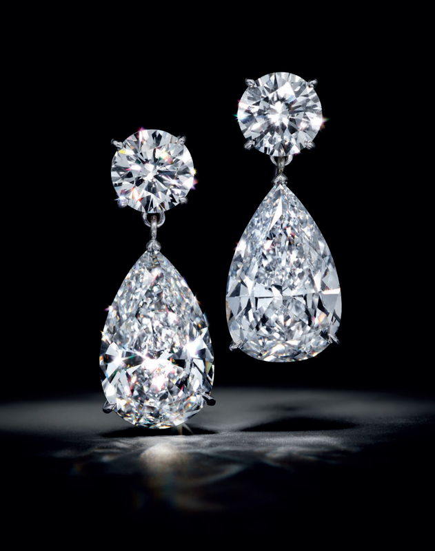 An elegant pair of diamond earrings, by Harry Winston