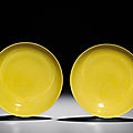 A fine pair of yellow-enamelled saucers, yongzheng six-character marks within double circles and of the period (1723-1735)