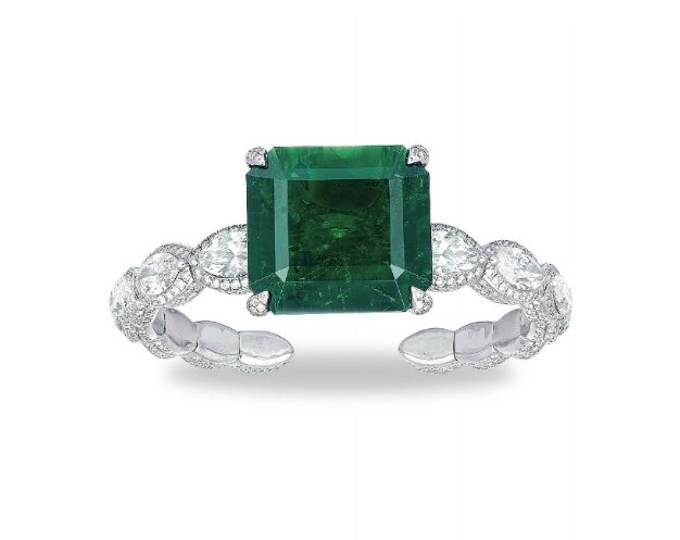 A stunning emerald and diamond bangle, by Etcetera