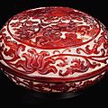 A finely carved imperial ruby-red overlay glass 'warriors' box and cover, Qing dynasty, Qianlong period (1736-1795)