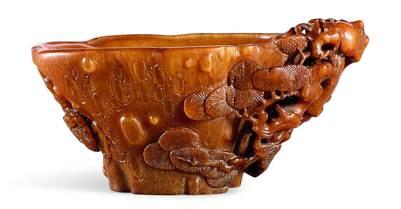 A small rhinoceros horn 'Pine' libation cup, 17th century