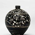 A finely carved black-glazed 'Bird and Flower' vase, Yuan dynasty (1279-1368)