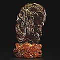 An amber carving and a stand; stand, qing dynasty, 18th century; carving, qing dynasty, 19th century