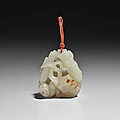 A russet-flecked white jade 'four arts' pendant, qianlong period (1736-1795)