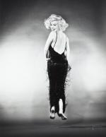 1959-10-NY-Jump_sitting-black_dress-by_halsman-030-1