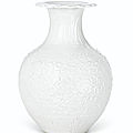 A molded white-glazed pomegranate-form vase, 18th century