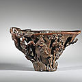 A carved rhinoceros horn 'landscape' libation cup, China, Qing Dynasty, 17th-18th century
