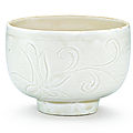 A carved dingyao 'lotus' cup, song dynasty (960-1279)