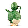A green-glazed pottery 'double-gourd' ewer, liao dynasty (907-1125)