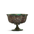 An engraved silver lobed 'floral' stem cup, tang dynasty (618-907)