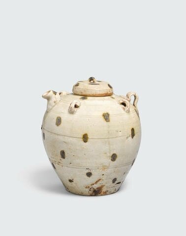A spotted celadon ewer and lid, Trần dynasty, 13th-14th century