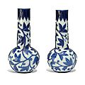 A pair of Chinese blue overlay glass 'squirrel and grape' vases, 19th century
