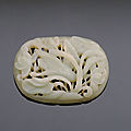 A jade oval openwork plaque, ming dynasty