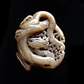 ﻿white jade dragon-shaped pendant, tang dynasty (618-907)