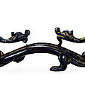 A bronze double dragons-form brush-rest, yuan dynasty, 13th-14th century