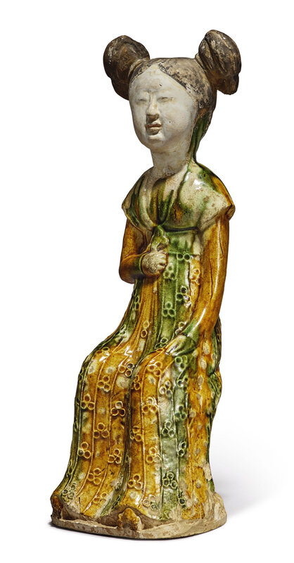 A sancai-glazed pottery figure of a seated court lady, Tang dynasty (618-907)