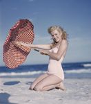 1949_tobey_beach_by_dedienes_umbrella_red_070_1