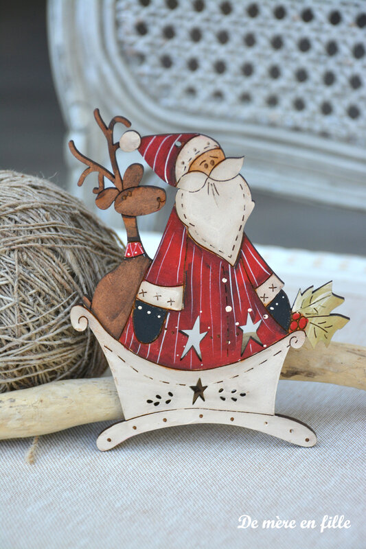 grand père noel et son renne dans le traineau