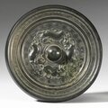 A BRONZE 'MYTHICAL BEASTS' MIRROR, SUI DYNASTY