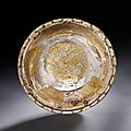 An engraved parcel-gilt silver 'ducks' bowl, tang dynasty (ad 618-907)