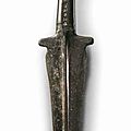 A bronze dagger with rattle, 12th-11th century bc