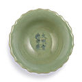 A small incised celadon-glazed dish, mark and period of xuande (1426-1435)