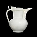 A rare incised white-glazed 'monk's cap' ewer, ming dynasty, yongle period 