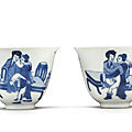 A pair of fine blue and white 'erotic' wine cups, qing dynasty, kangxi period (1662-1722)