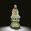 A moulded 'longquan' celadon figure of buddha, ming dynasty, 15th century
