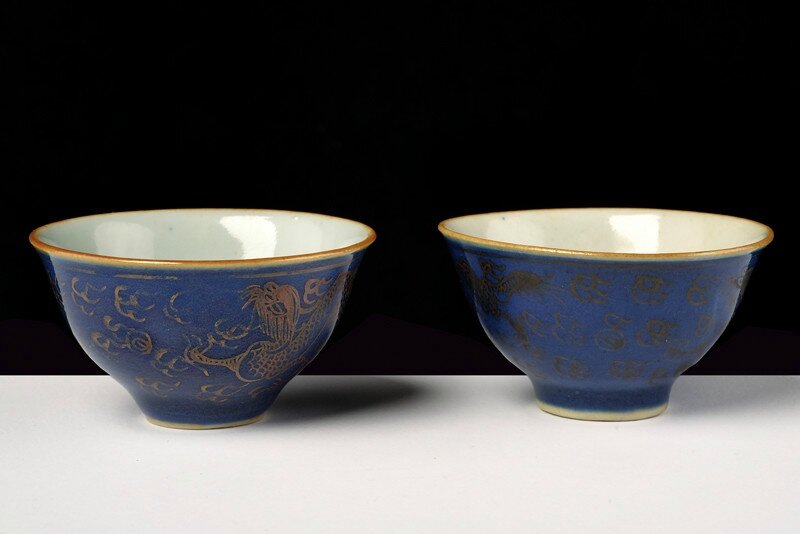 A fine pair of powder blue and gold porcelain cups, 19th Century